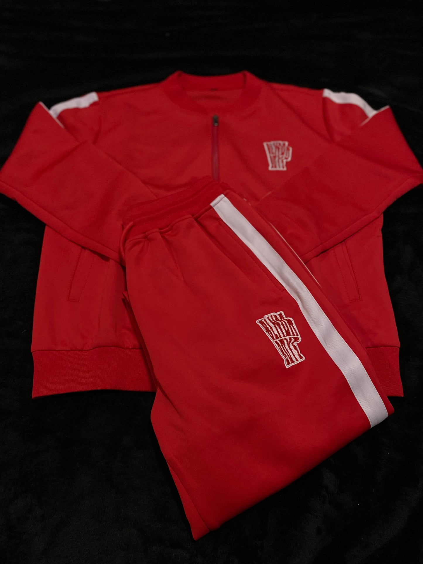 “Trappin ain’t dead” tracksuits