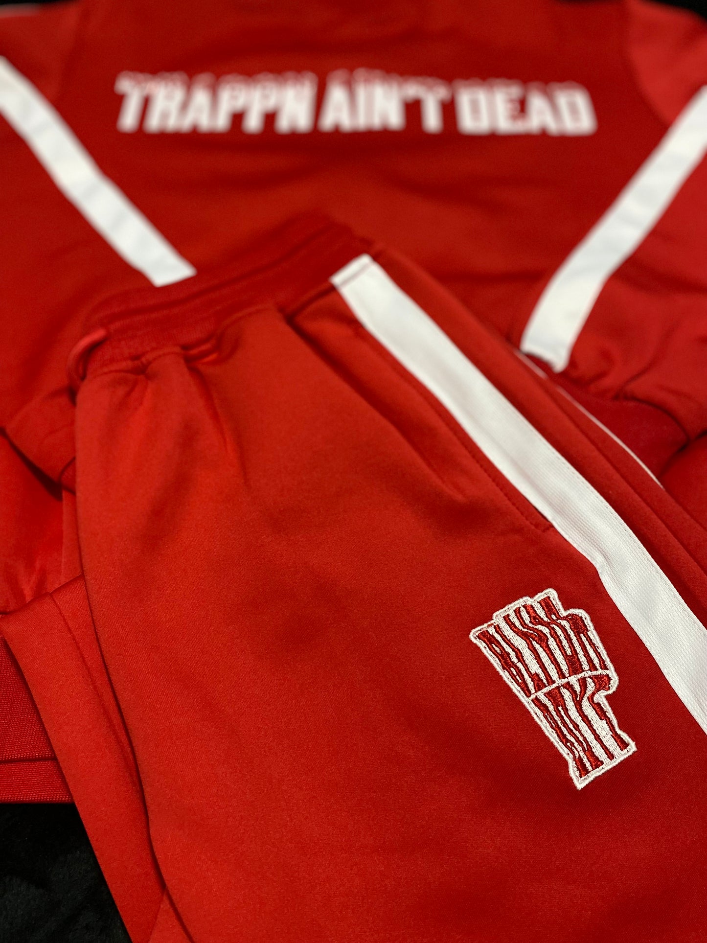 “Trappin ain’t dead” tracksuits