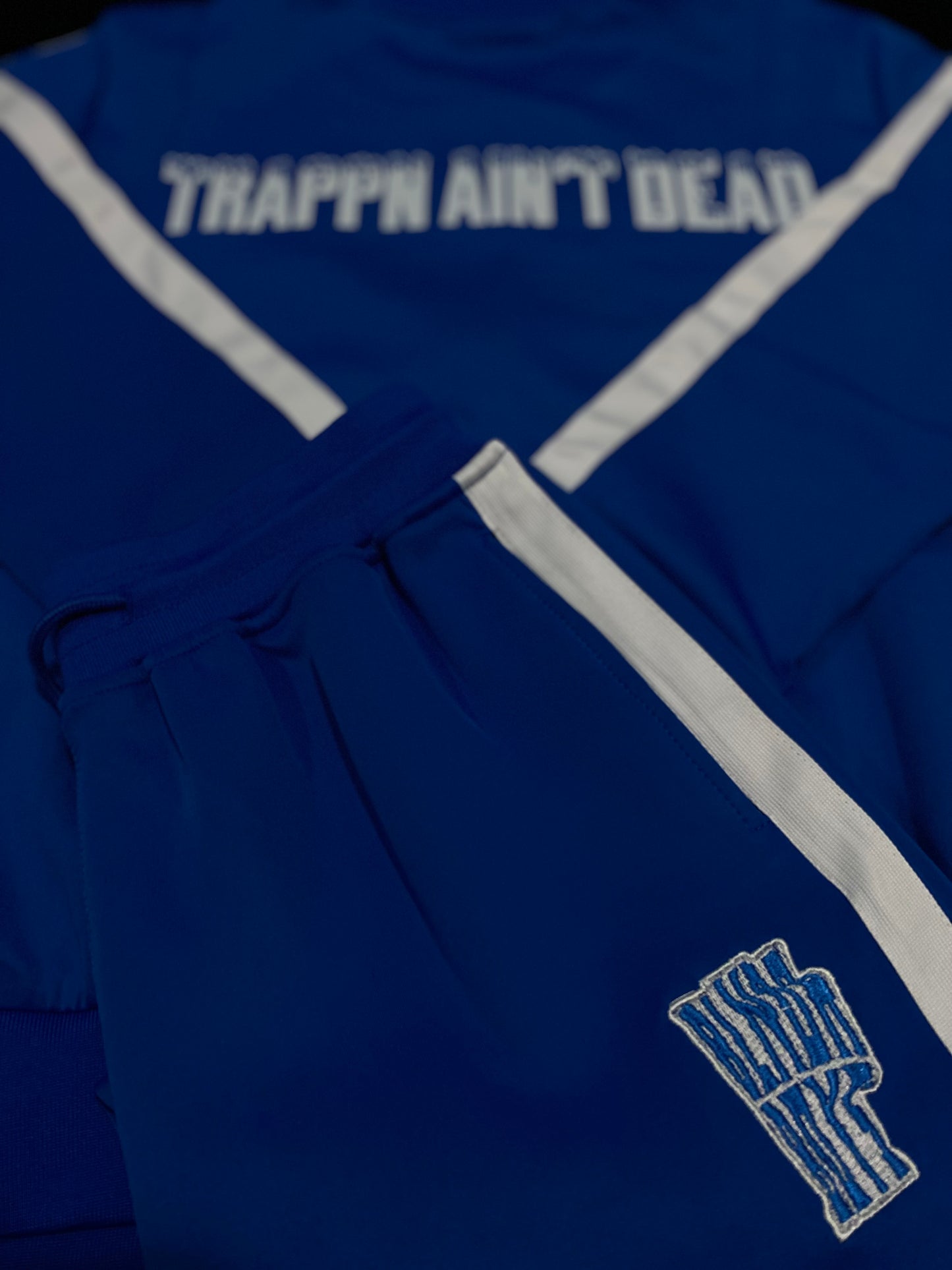 “Trappin ain’t dead” tracksuits