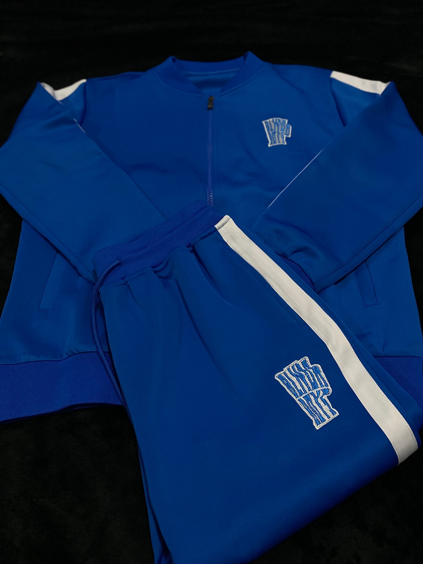 “Trappin ain’t dead” tracksuits