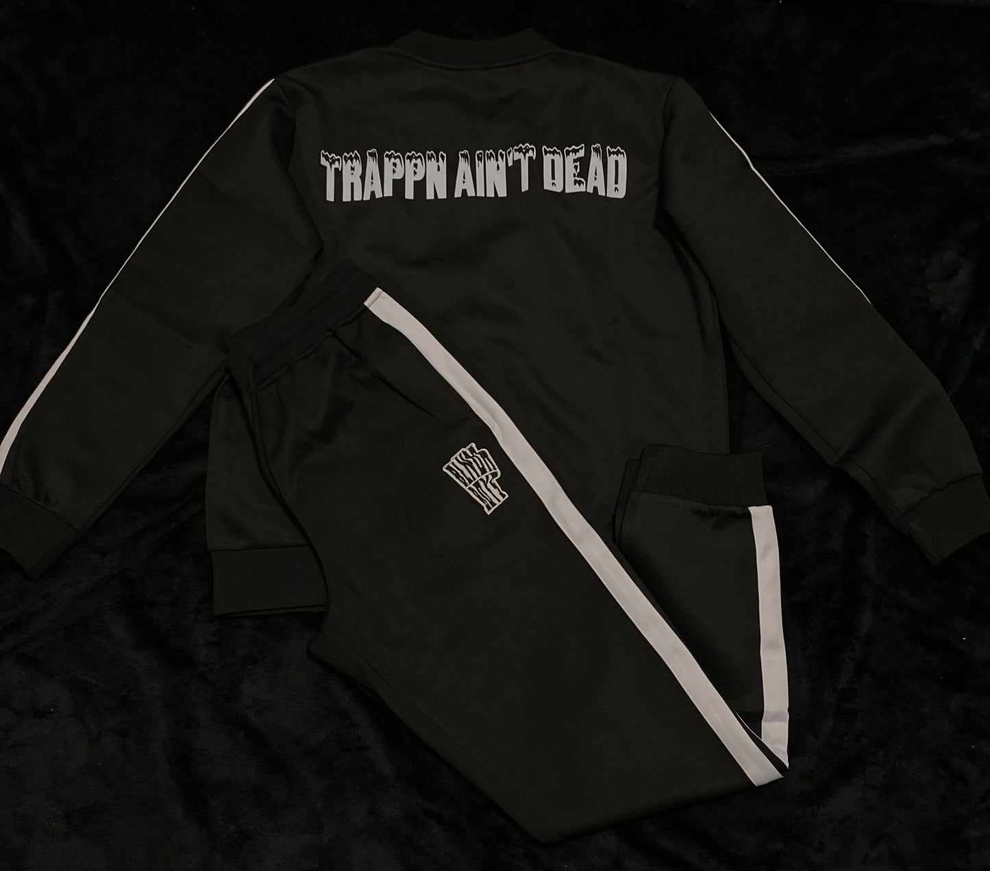“Trappin ain’t dead” tracksuits