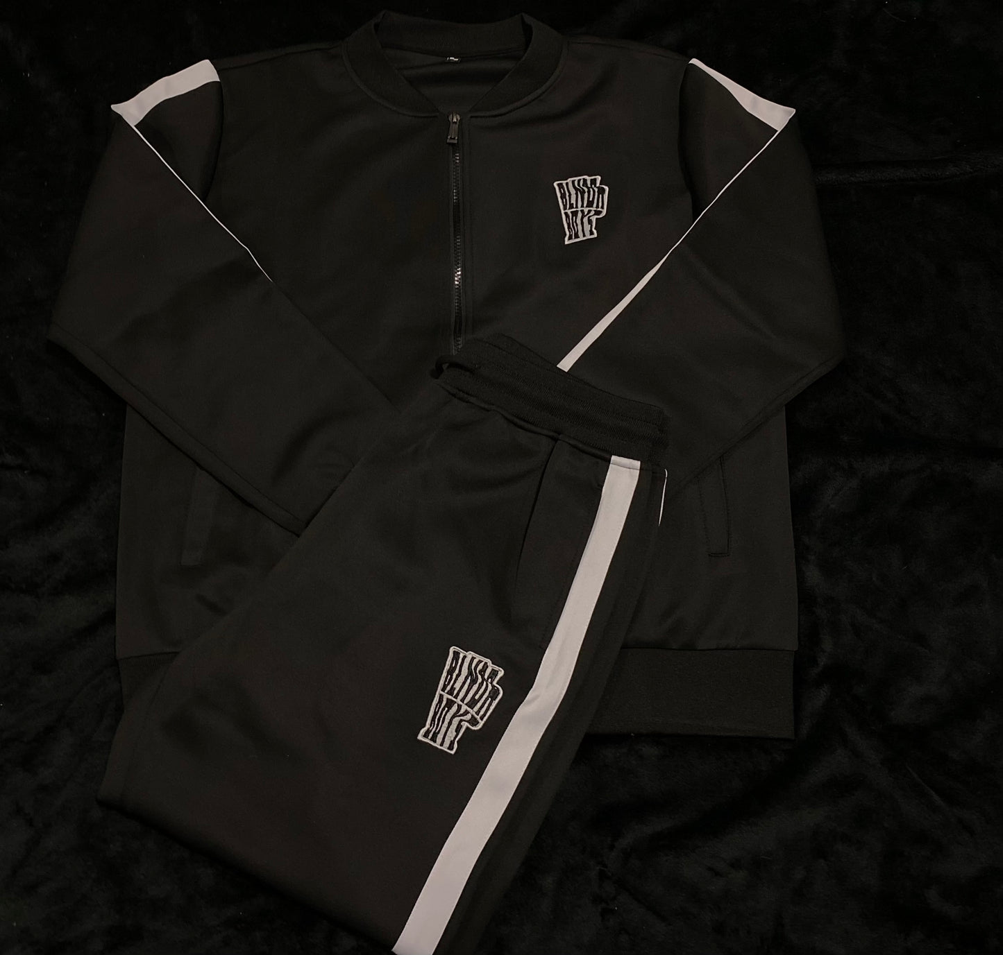 “Trappin ain’t dead” tracksuits