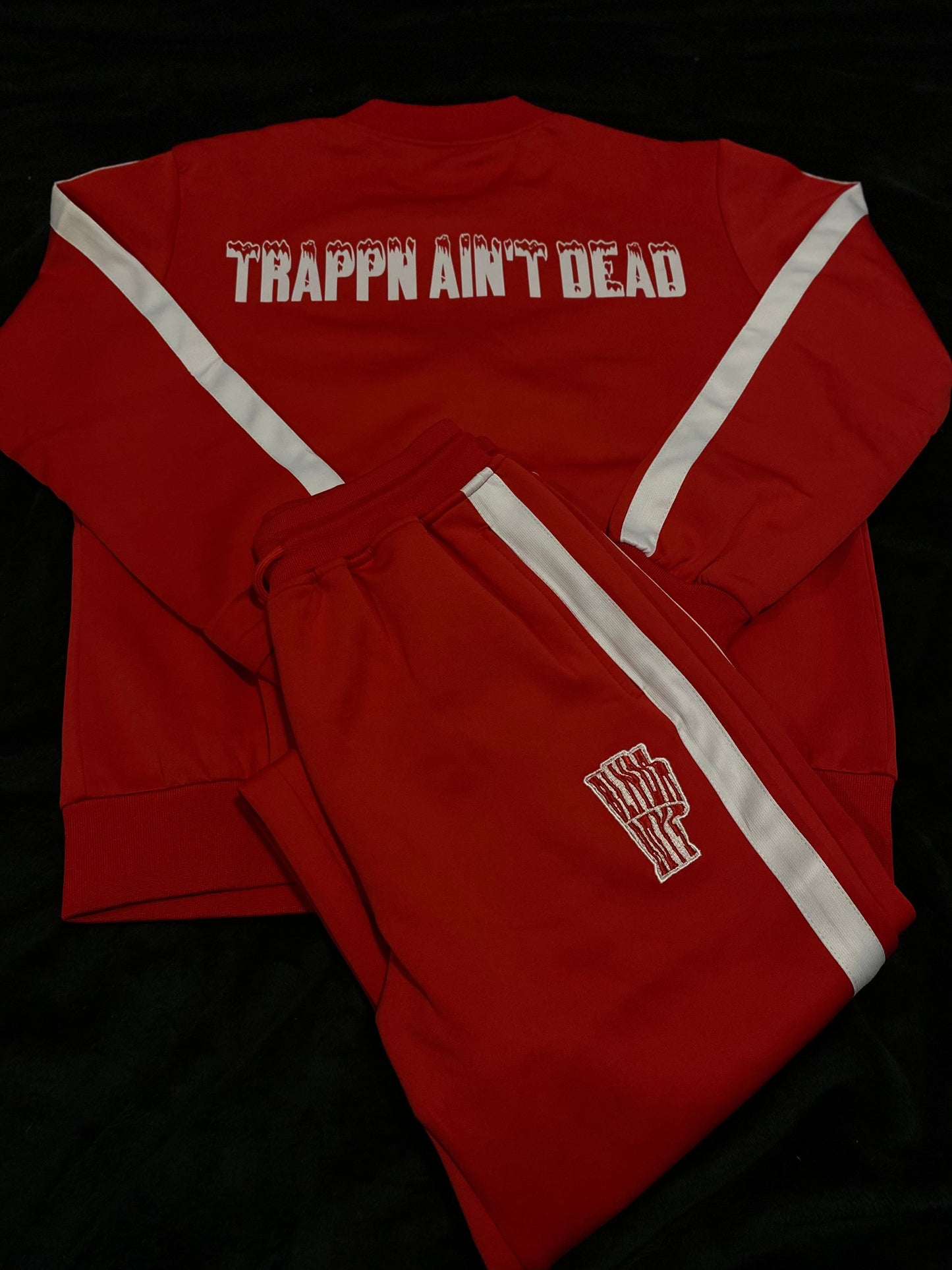 “Trappin ain’t dead” tracksuits